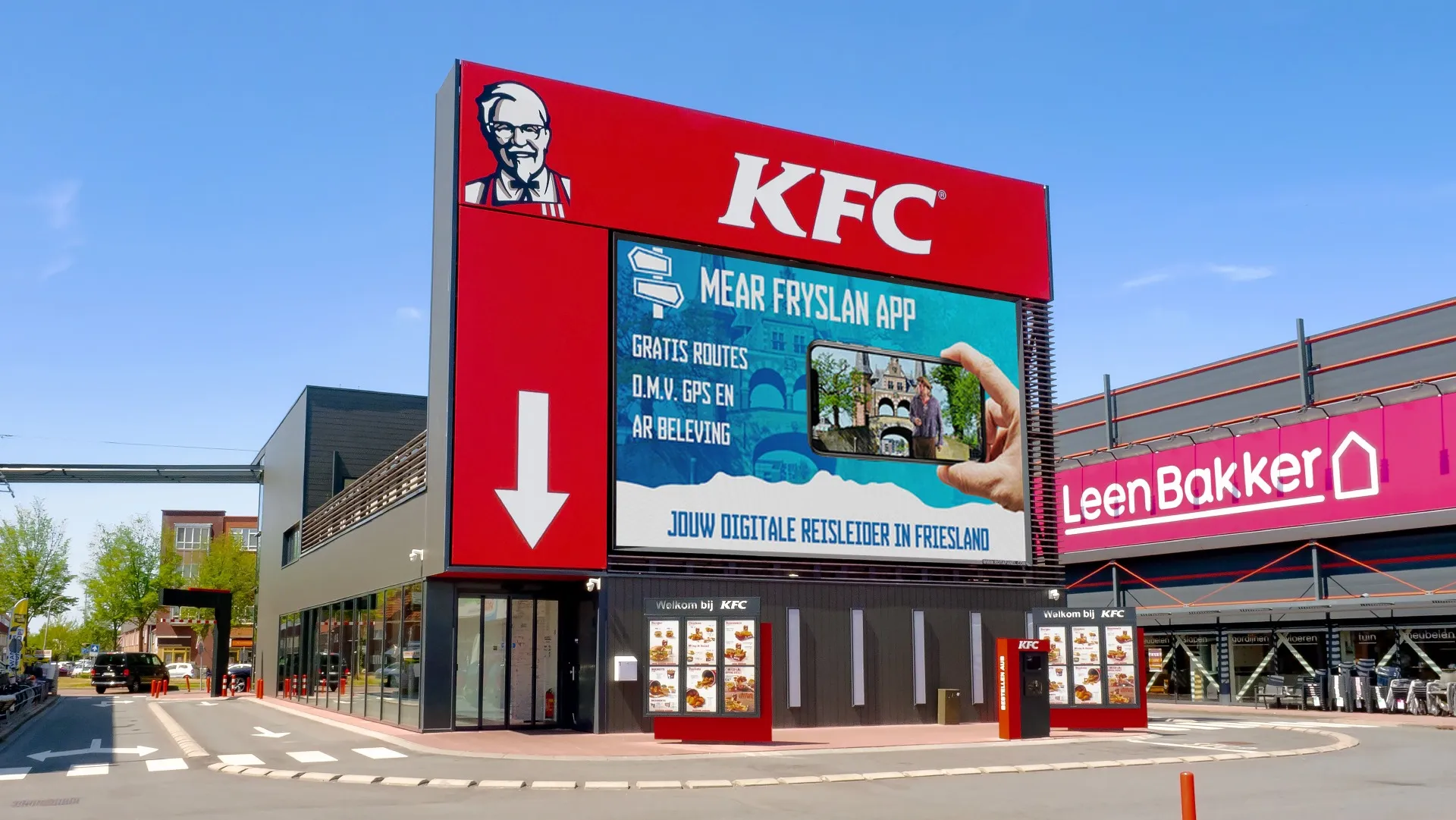 Biển quảng cáo lớn gắn trên cửa hàng KFC với nền đỏ nổi bật, logo Đại tá Sanders